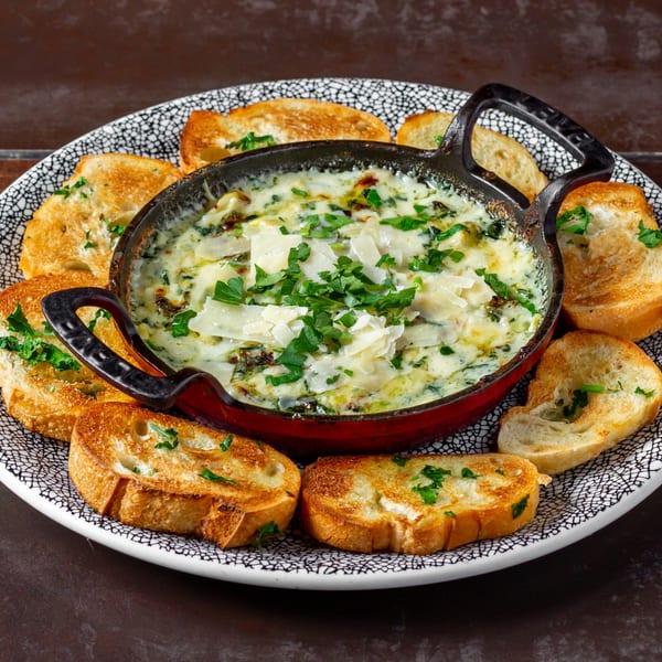 Lena's Wood-Fired Pizza & Tap's creamy spinach and artichoke dip with parmesan and toasted bread.